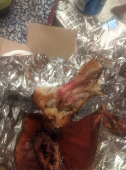Consumer Food Safety Report Domino's, Canada ordered wings, they were still pink and undercooked. Sent them back and got new one... photo #1