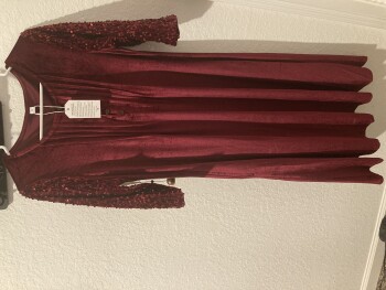 I received a package with no packing slip from RETURNEP. I did not order the dress. photo #1