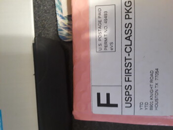 Pink bubble wrap package with a typed note inside photo #1