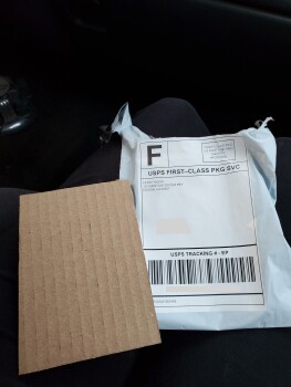 Package in mailbox of a cardboard foto #1