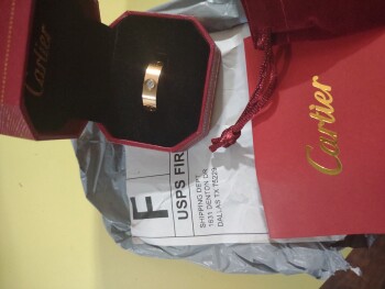 Actually, I am doing this for my husband, but he received a "Cartier" ring from the address photo #1