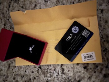 Ring that I did not order. Their site shows a cost. How can they chg me without my info? photo #1