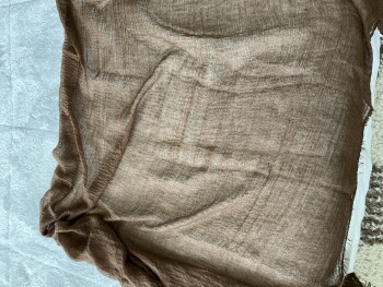 I got a 3 foot piece of brown material photo #1