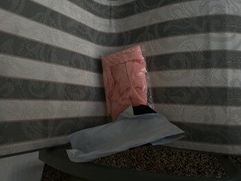 I am reporting a package with a defective orange scarf that I did NOT order photo #1