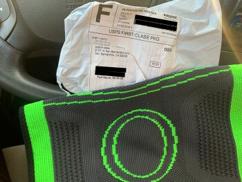 Why did I receive this black and green knee brace photo #1