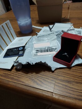 Received a moissanite ring in the mail today.   What should I do with it. photo #1