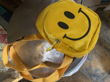 Received a yellow smiley face bag unsolicited صورة فوتوغرافية #1