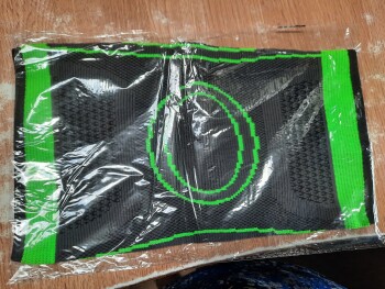 تقرير سلامة المستهلك Package I did not order Small white plastic envelope. 
Black with green  strecth knee support.
EB/... صورة فوتوغرافية #1